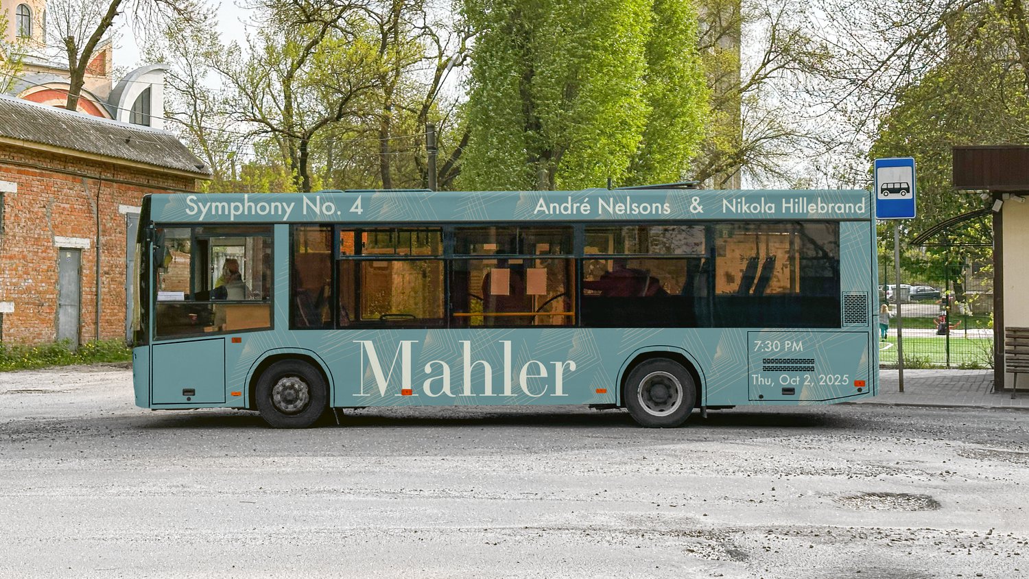 A city bus wrapped in the teal Mahler poster artwork